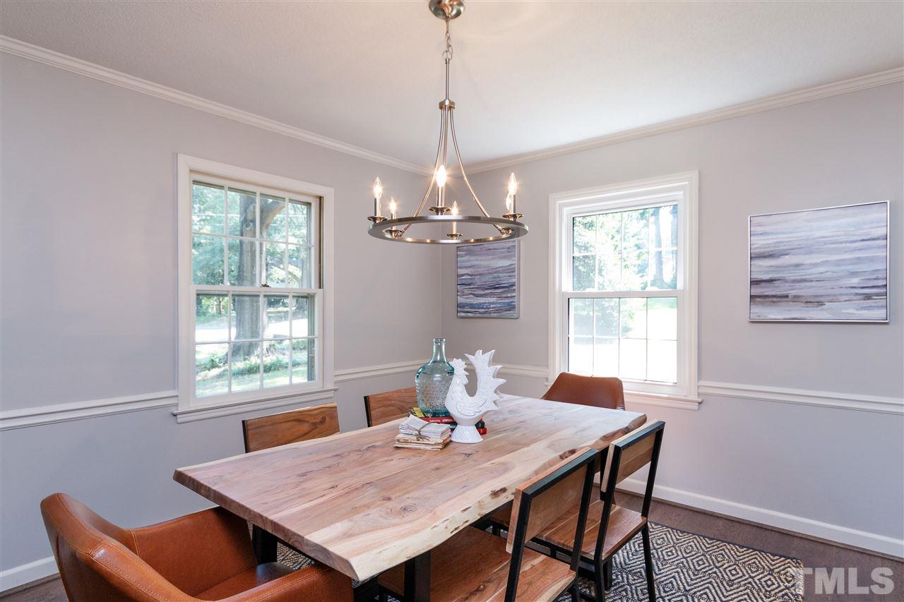 2911 Buckingham Road Durham, NC 27707 - Photo 5 of 25 a view of a dining room with furniture window and outside view