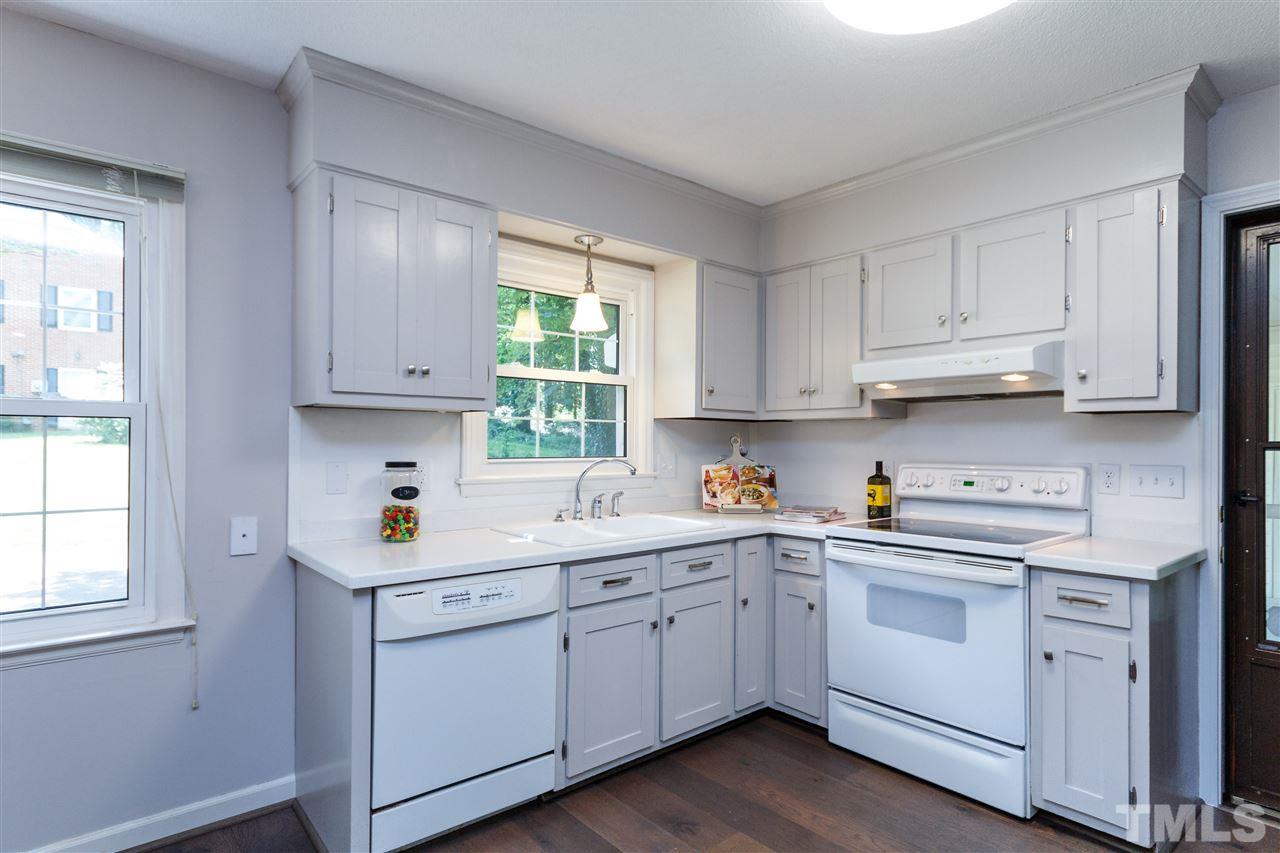 2911 Buckingham Road Durham, NC 27707 - Photo 10 of 25 a kitchen with cabinets appliances a sink and a window