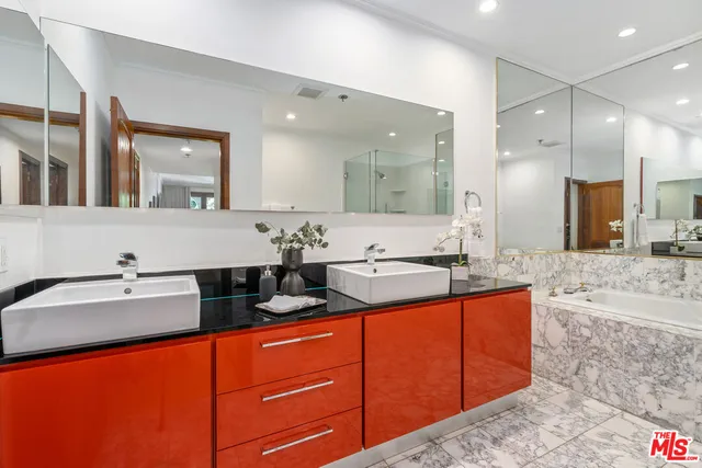 a spacious bathroom with a granite countertop sink mirror and