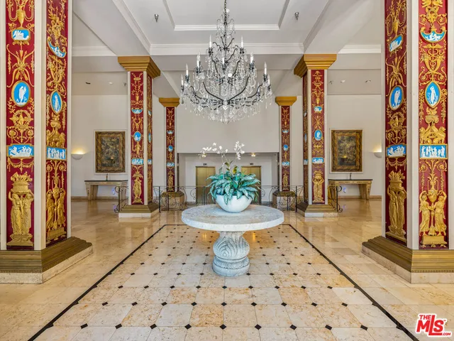 a dining room with furniture and a chandelier