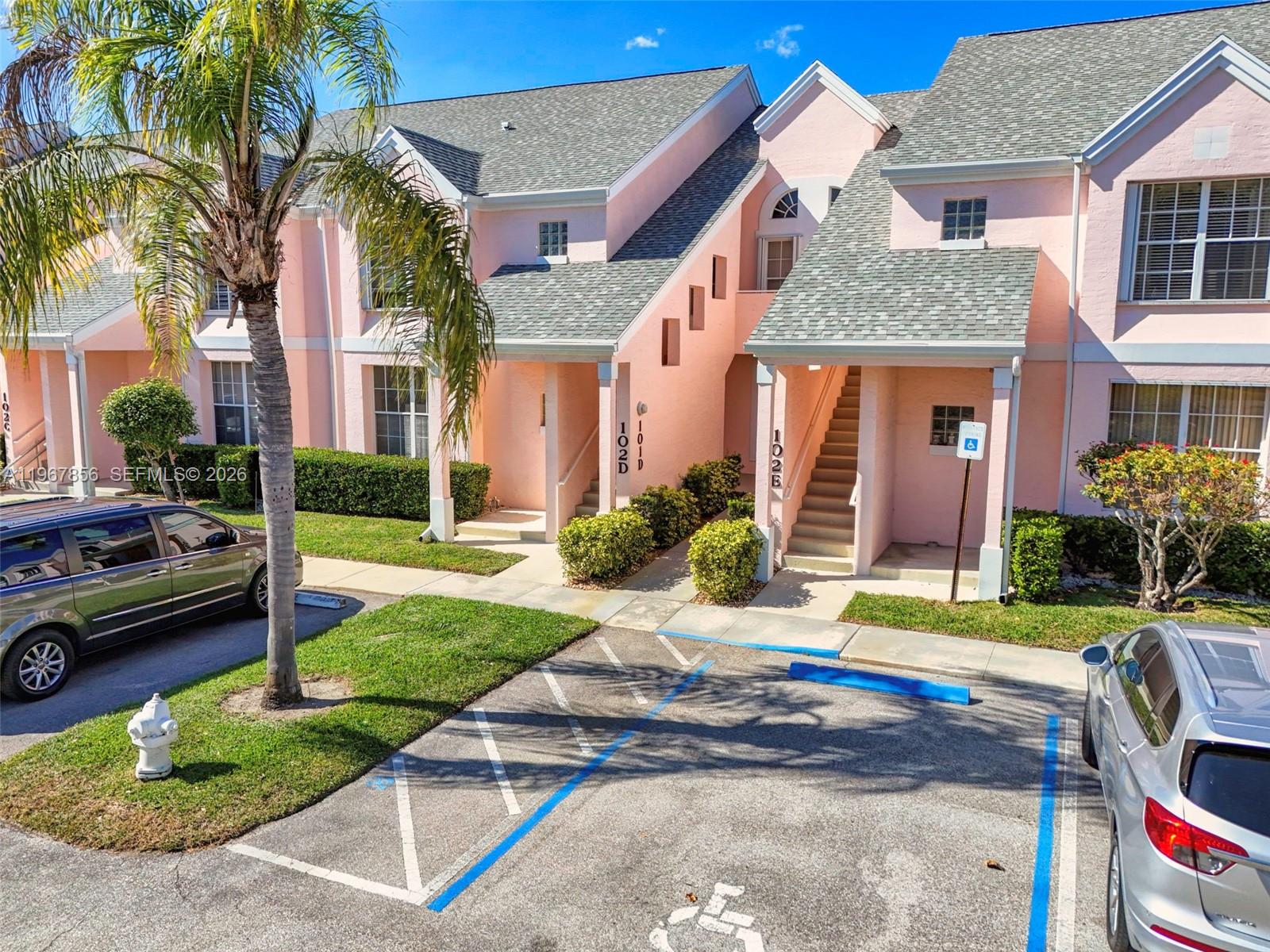 101 Muirfield Court, Unit 101D Jupiter, FL 33458 - Photo 1 of 62 a front view of a house with garden
