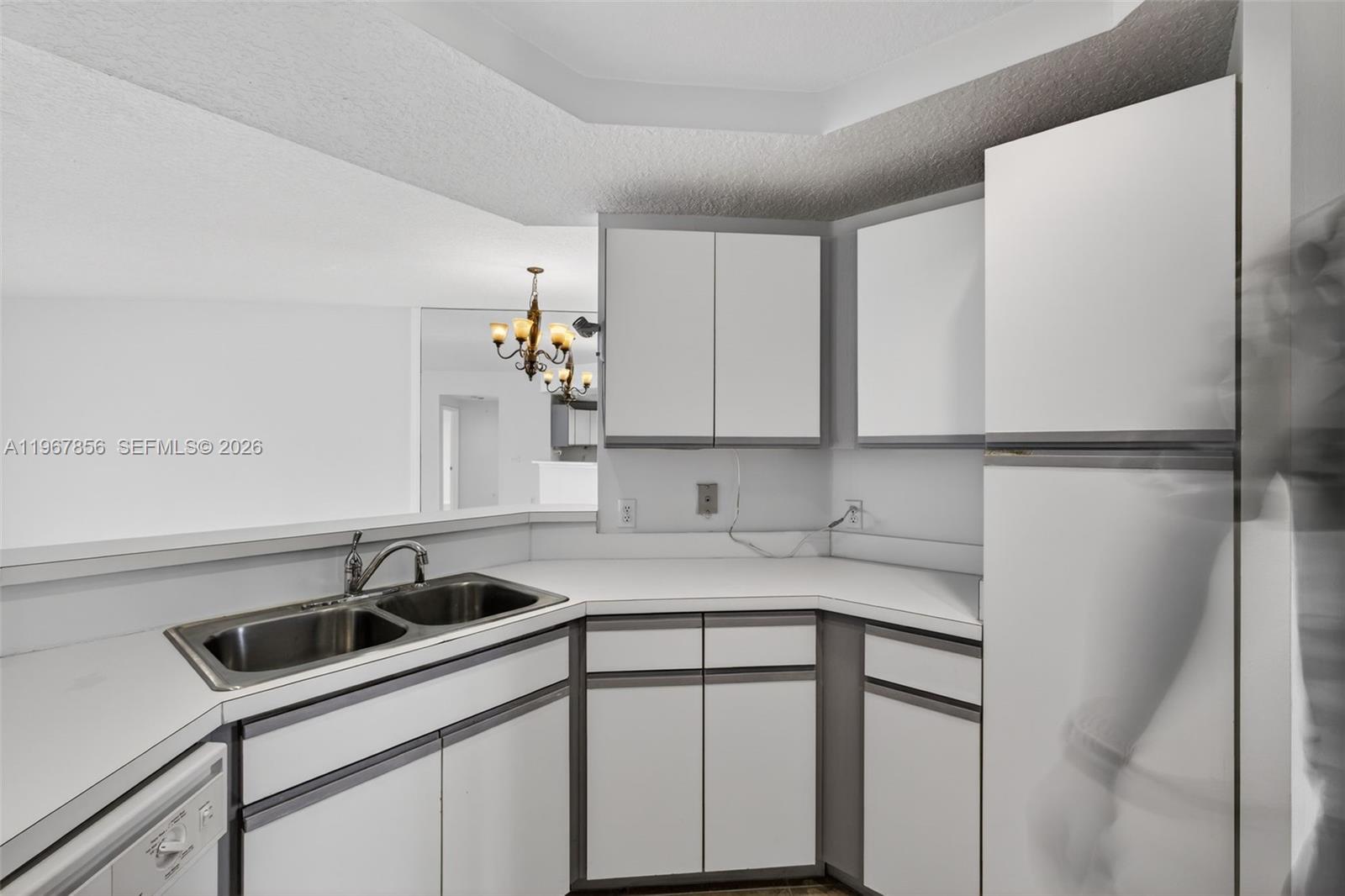 101 Muirfield Court, Unit 101D Jupiter, FL 33458 - Photo 15 of 62 a kitchen with a sink cabinets and appliances