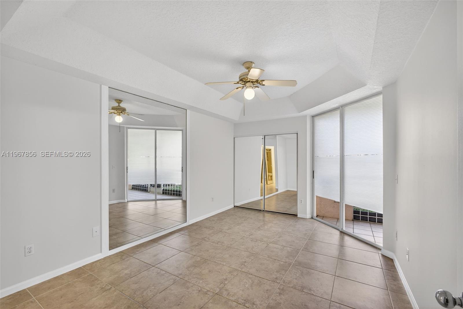 101 Muirfield Court, Unit 101D Jupiter, FL 33458 - Photo 18 of 62 wooden floor in an empty room with a window