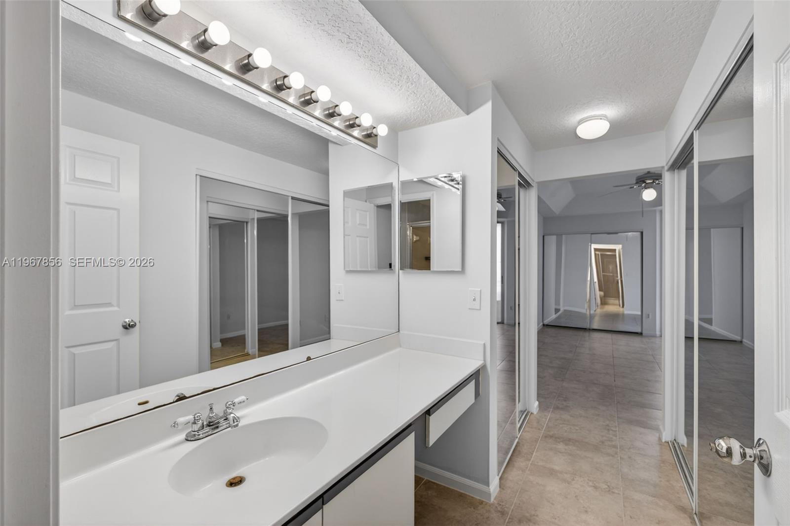 101 Muirfield Court, Unit 101D Jupiter, FL 33458 - Photo 20 of 62 a bathroom with a sink double vanity and shower