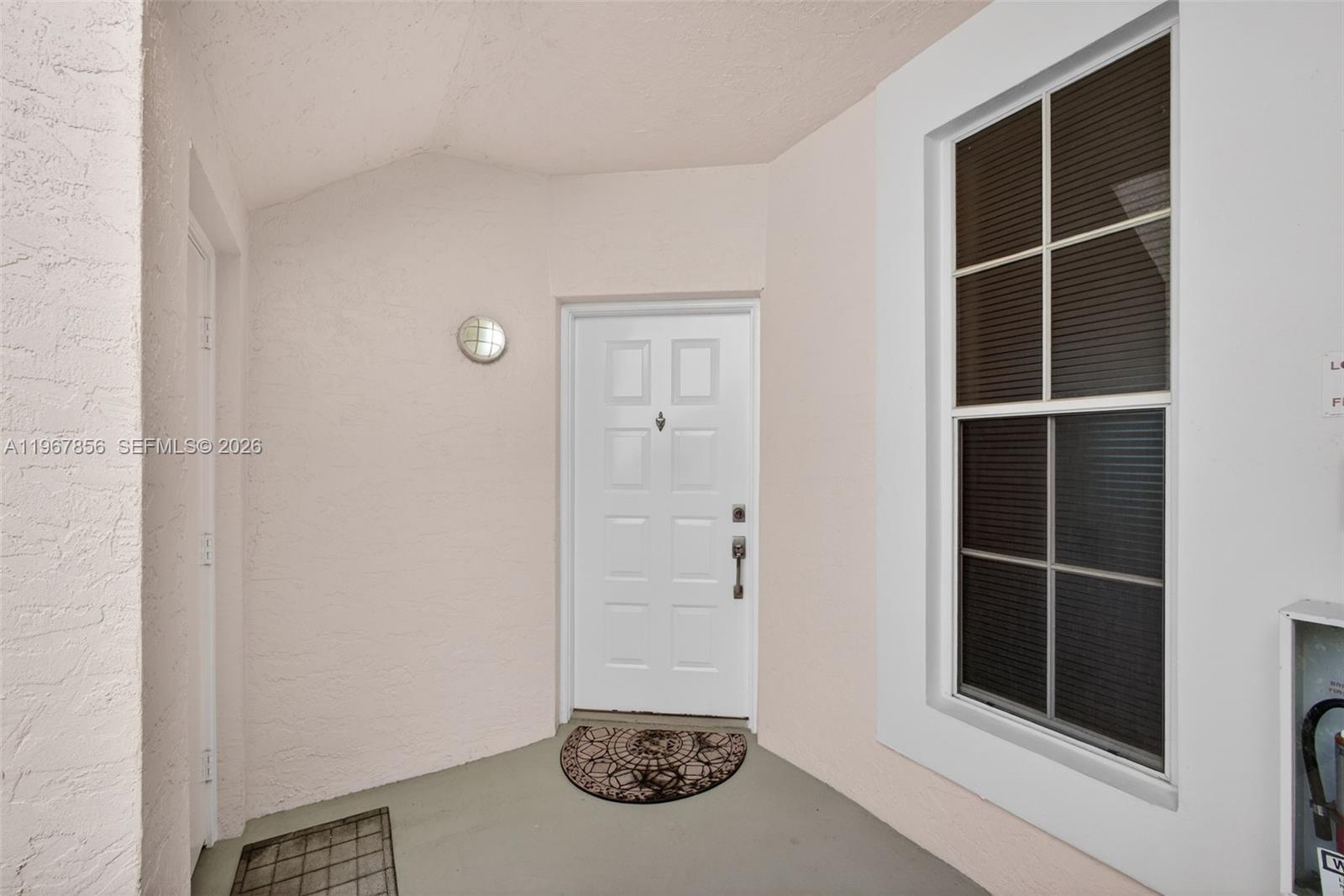 101 Muirfield Court, Unit 101D Jupiter, FL 33458 - Photo 2 of 62 a view of an empty room with wall space