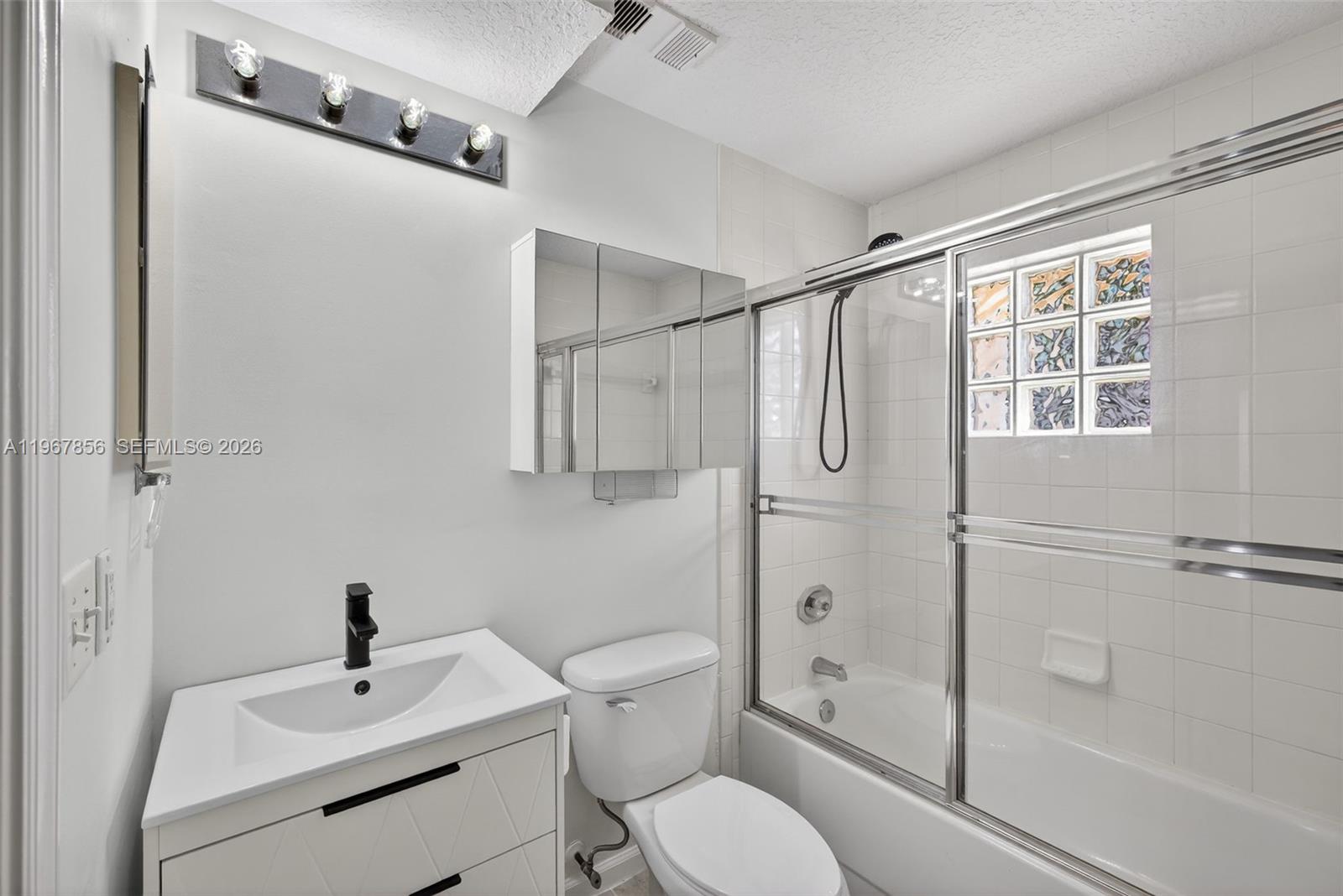 101 Muirfield Court, Unit 101D Jupiter, FL 33458 - Photo 25 of 62 a bathroom with a toilet sink and shower