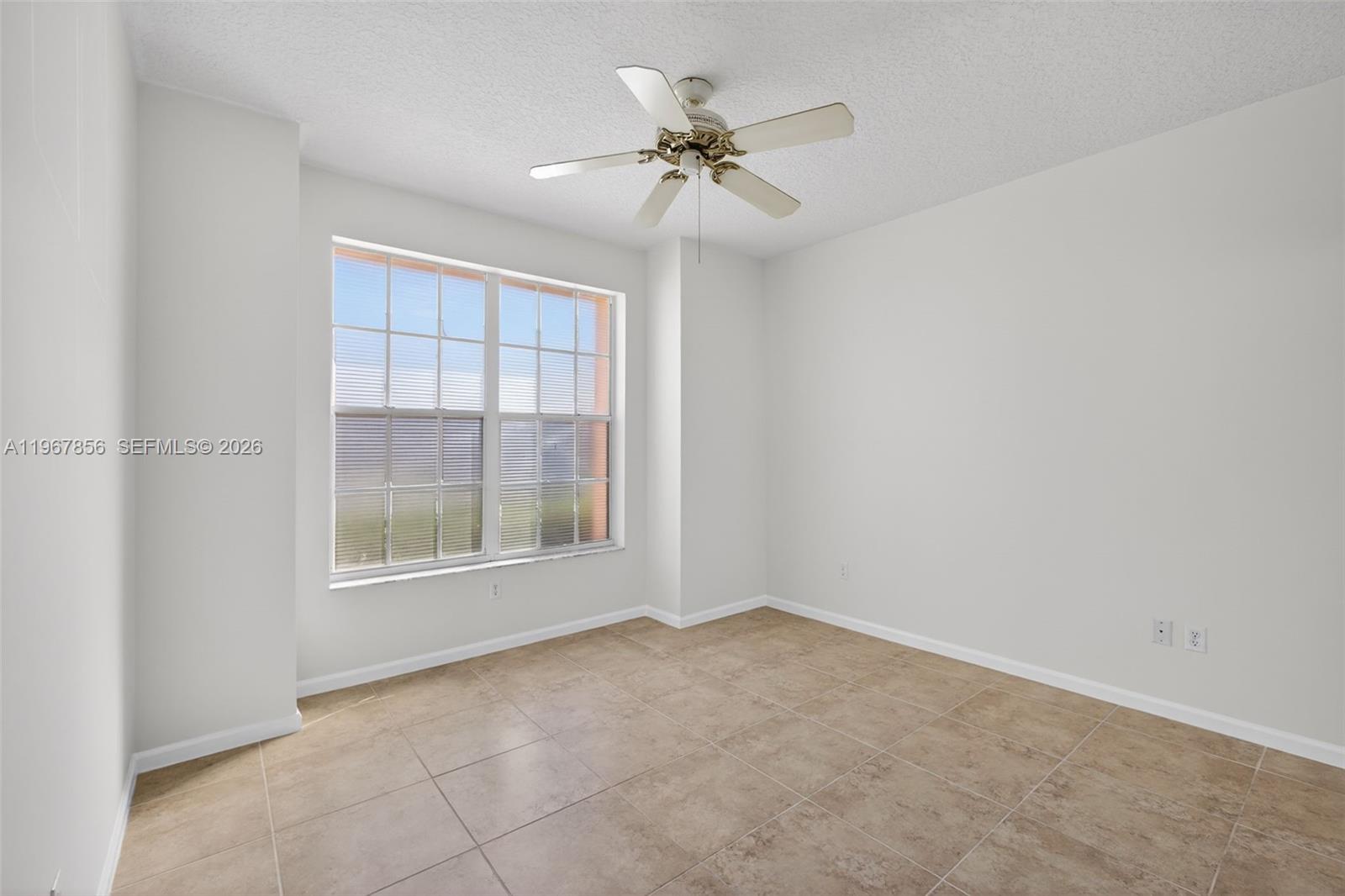 101 Muirfield Court, Unit 101D Jupiter, FL 33458 - Photo 27 of 62 an empty room with a window