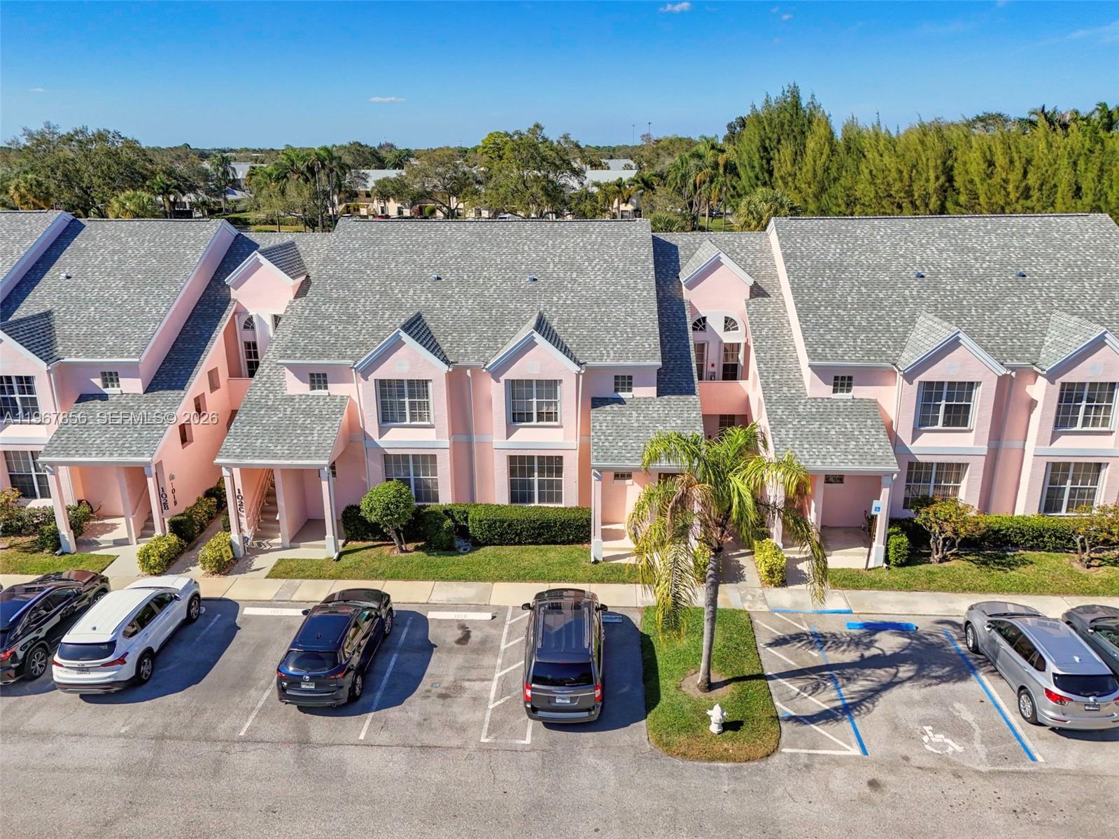 101 Muirfield Court, Unit 101D Jupiter, FL 33458 - Photo 45 of 62 a view of multiple houses with a yard