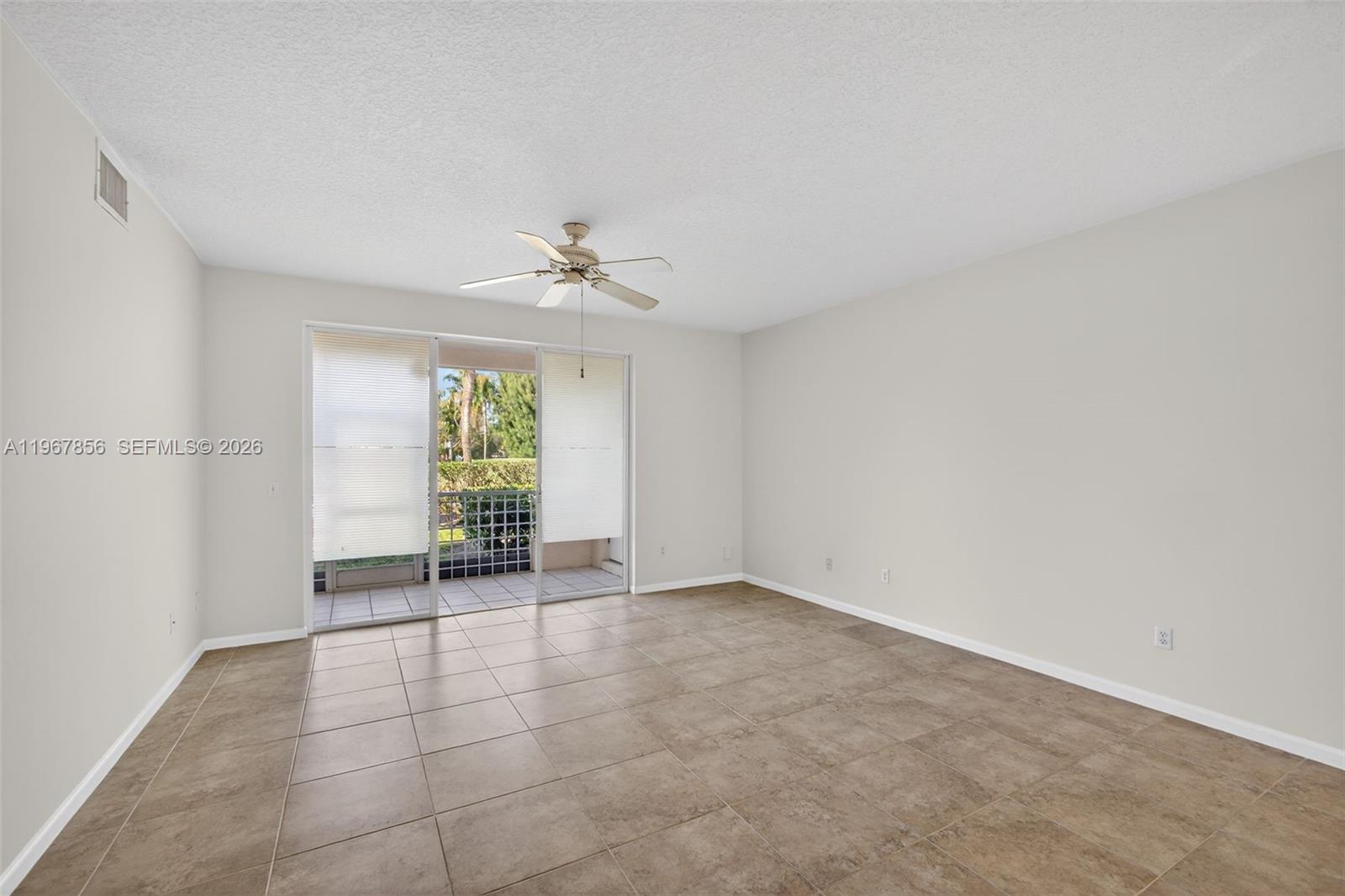 101 Muirfield Court, Unit 101D Jupiter, FL 33458 - Photo 6 of 62 a view of an empty room with a window