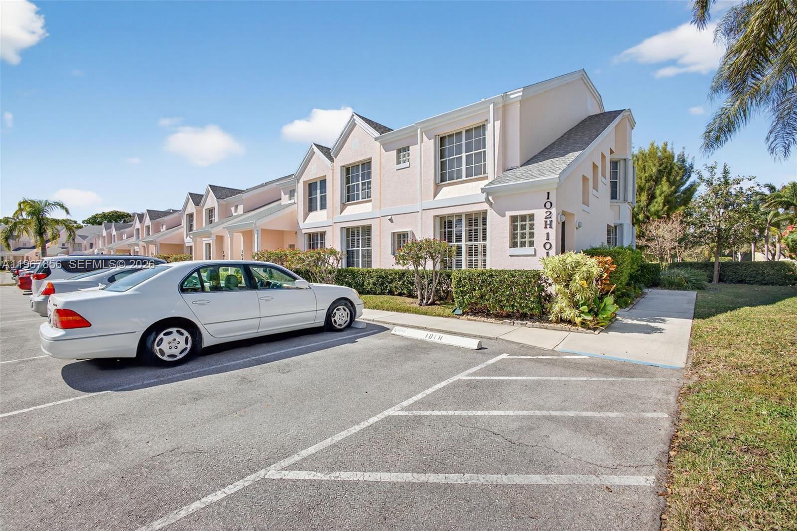 101 Muirfield Court, Unit 101D Jupiter, FL 33458 - Photo 61 of 62 a car parked in front of a house