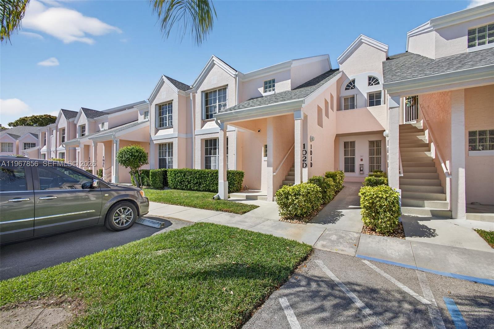 101 Muirfield Court, Unit 101D Jupiter, FL 33458 - Photo 62 of 62 a car parked in front of a house