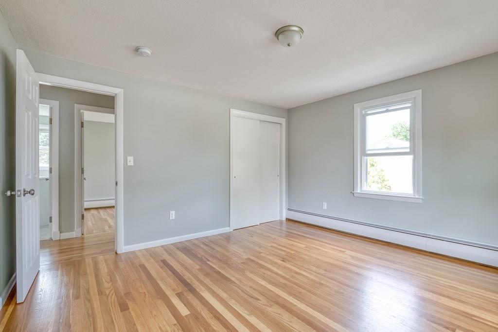 19 Knowlton Road Nashua, NH 03063 - Photo 18 of 35 a view of empty room with wooden floor and fan