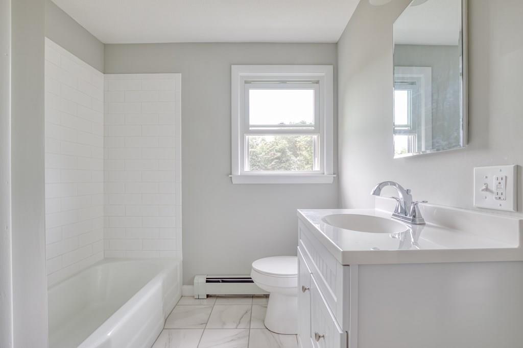 19 Knowlton Road Nashua, NH 03063 - Photo 19 of 35 a bathroom with a sink a toilet and shower