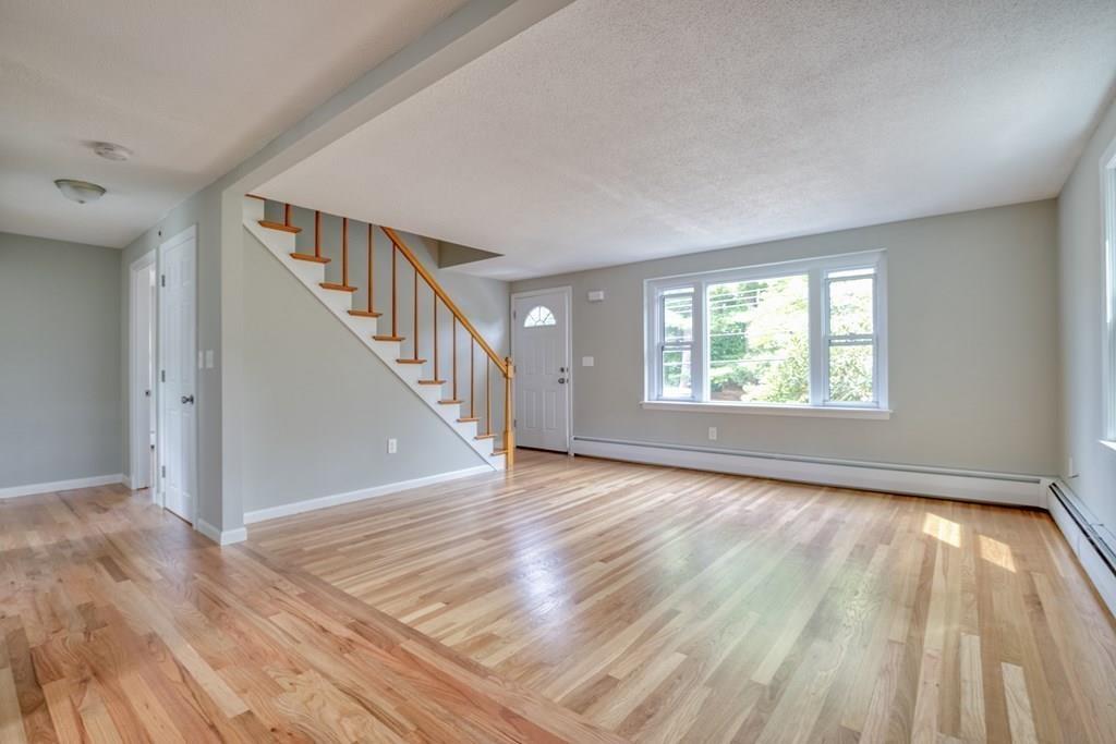 19 Knowlton Road Nashua, NH 03063 - Photo 3 of 35 wooden floor in an empty room with a window