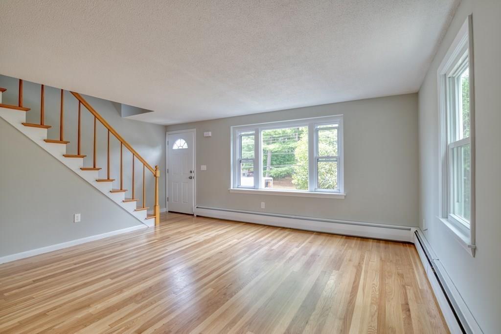 19 Knowlton Road Nashua, NH 03063 - Photo 6 of 35 wooden floor in an empty room with a window