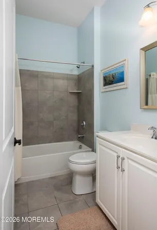a bathroom with a toilet a sink and bathtub