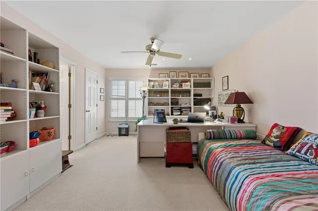 a bedroom with a bed furniture and decor