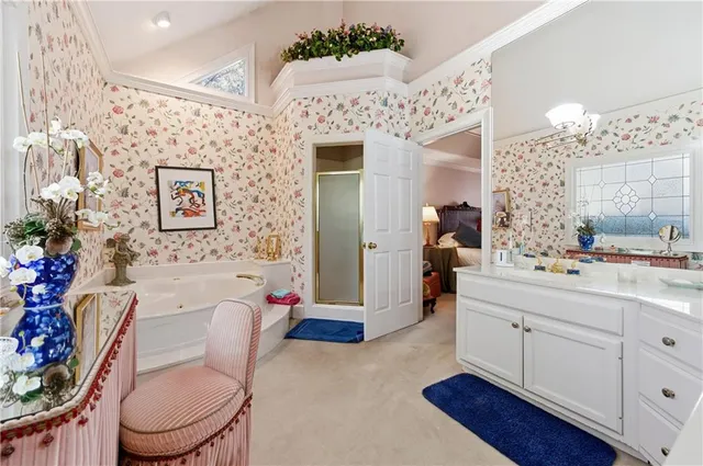 a bathroom with a sink vanity mirror and toilet