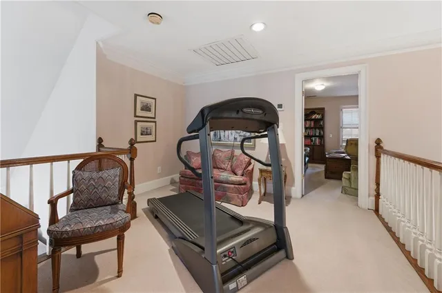a living room with furniture a rug and a window