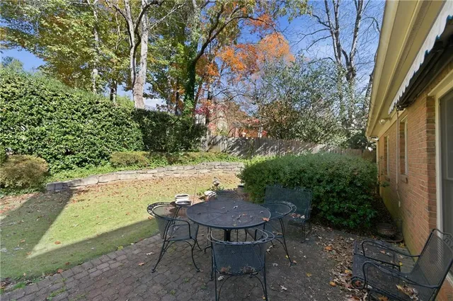 a view of a backyard with furniture