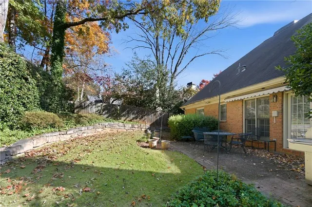 a view of a backyard with sitting area