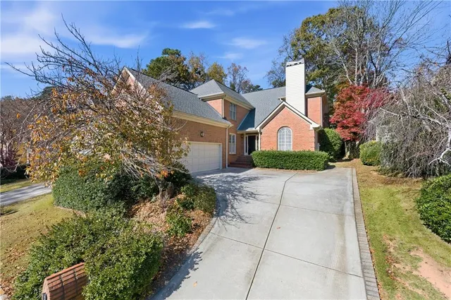 a house with trees in front of it