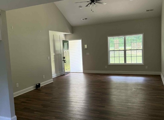 51 Bluff Creek Road Brush Creek, TN 38547 - Photo 12 of 23 an empty room with wooden floor and windows