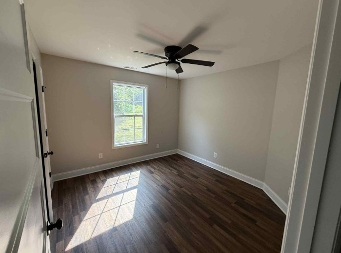 51 Bluff Creek Road Brush Creek, TN 38547 - Photo 15 of 23 a view of an empty room with wooden floor and a window