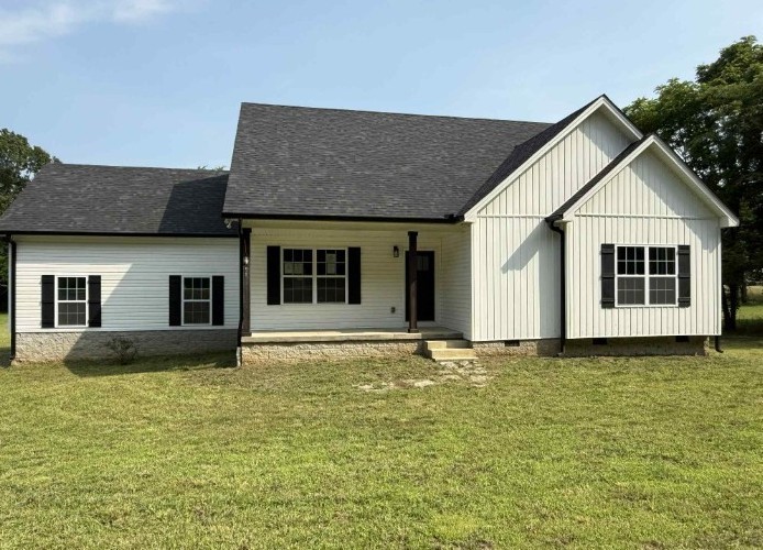 51 Bluff Creek Road Brush Creek, TN 38547 - Photo 2 of 23 a house that has a large window in it