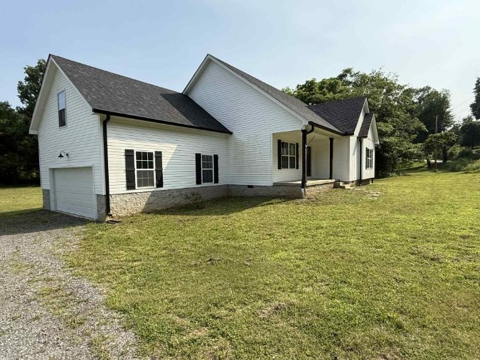 51 Bluff Creek Road Brush Creek, TN 38547 - Photo 3 of 23 a front view of a house with garden