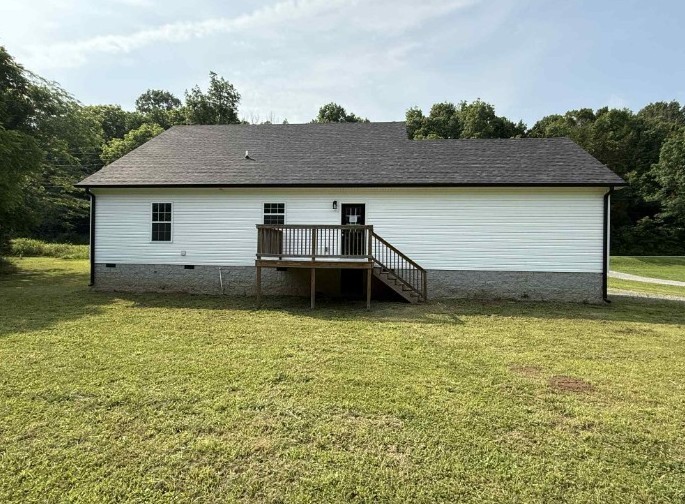 51 Bluff Creek Road Brush Creek, TN 38547 - Photo 6 of 23 a front view of house with yard and trees in the background