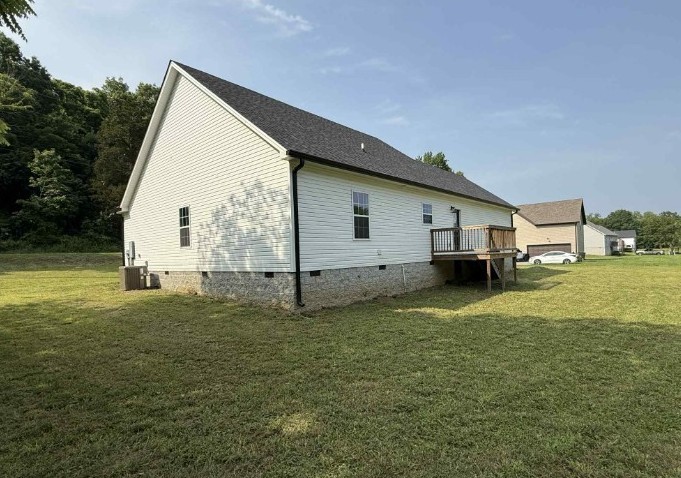 51 Bluff Creek Road Brush Creek, TN 38547 - Photo 7 of 23 a view of a house with backyard