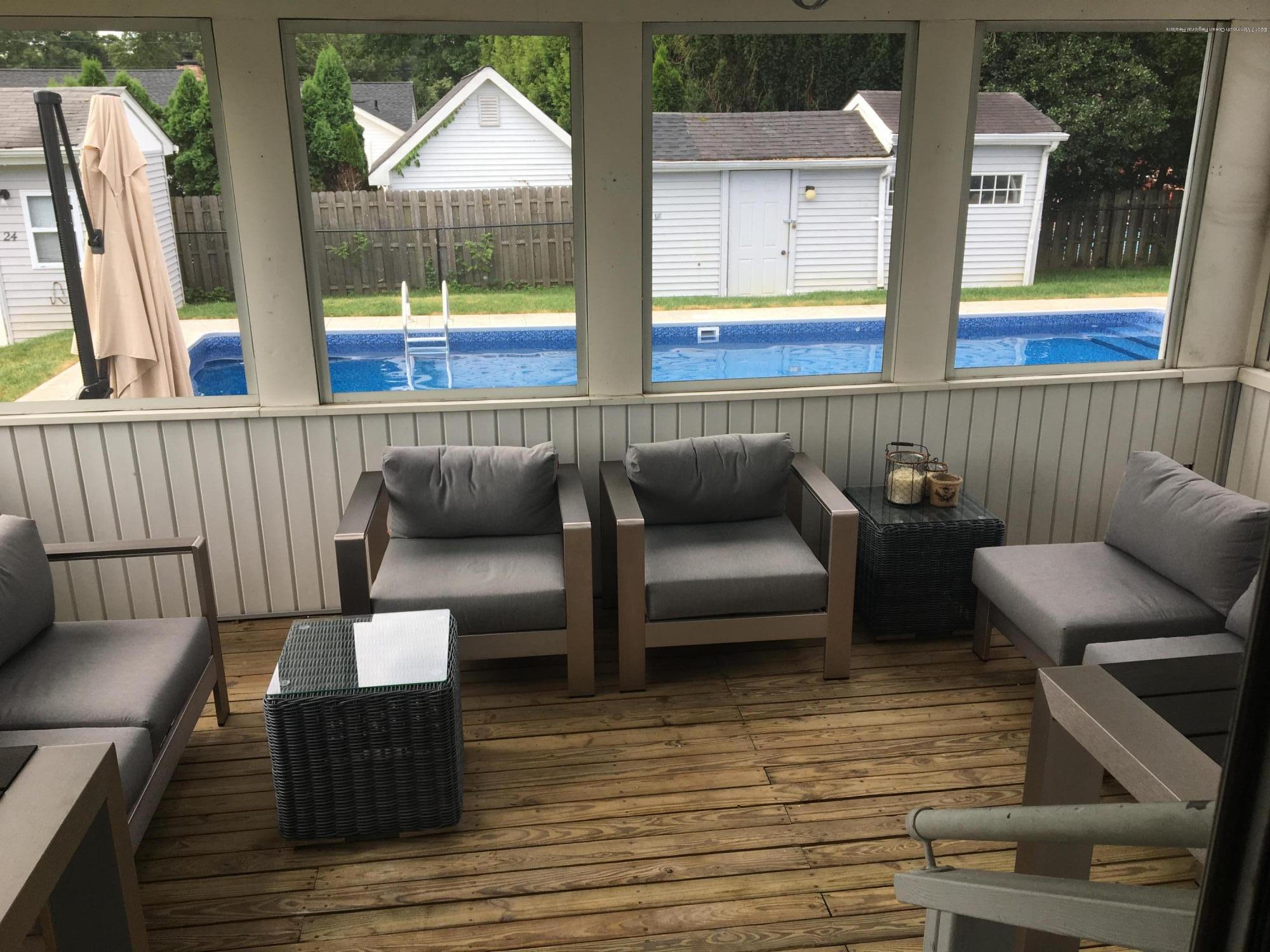 a view of two chairs in the balcony