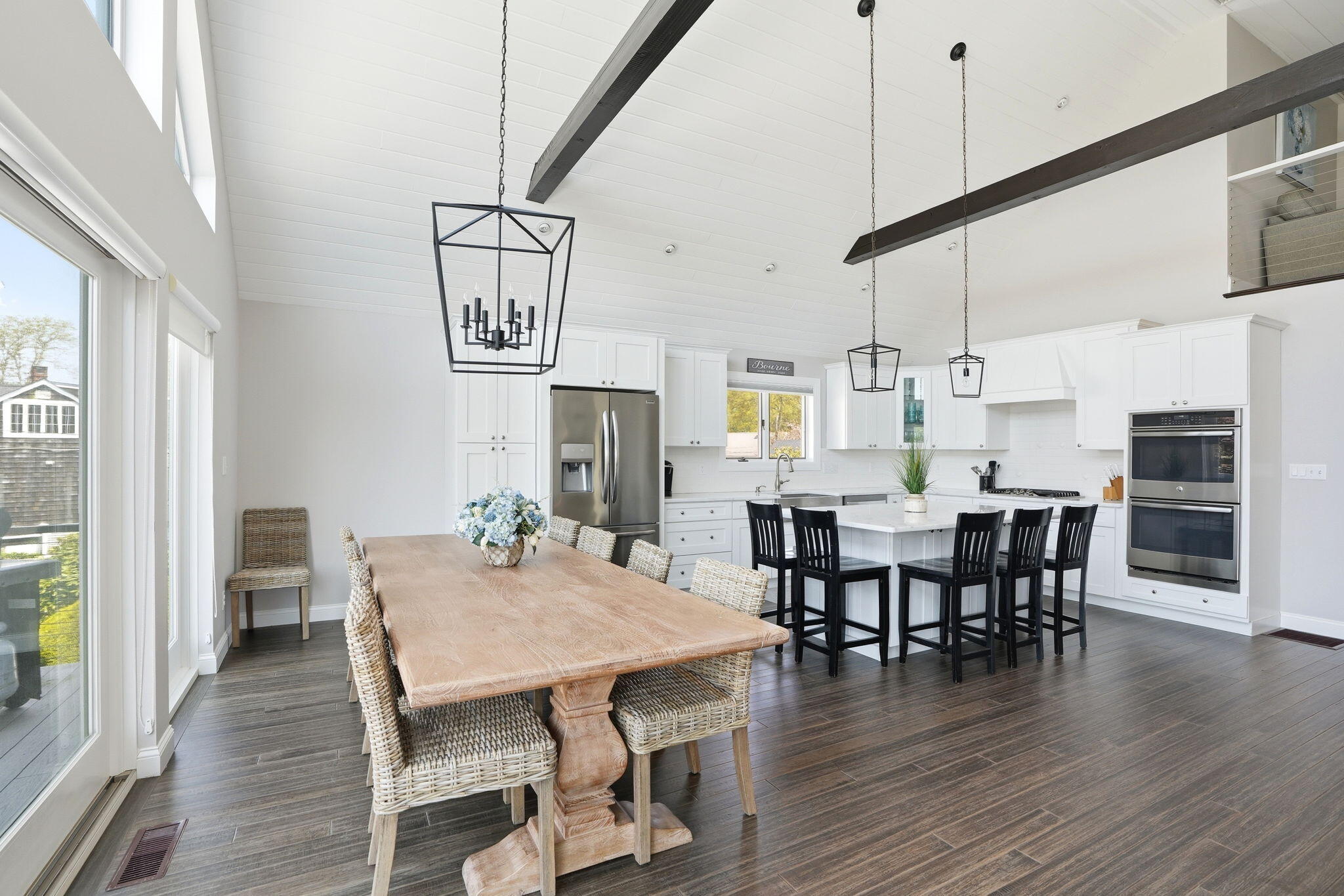 4 Cross Road Bourne, MA 02532 - Photo 15 of 47 a view of a dining room with furniture a chandelier and wooden floor