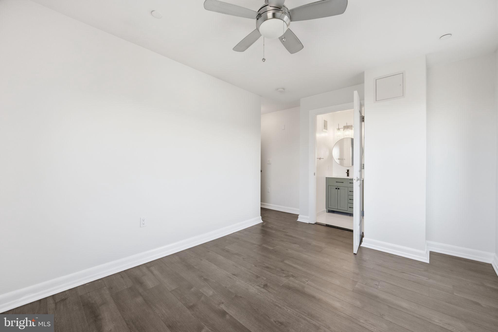 401 15th Street Southeast, Unit 401 Washington, DC 20003 - Photo 14 of 21 a view of empty room with wooden floor and ceiling fan