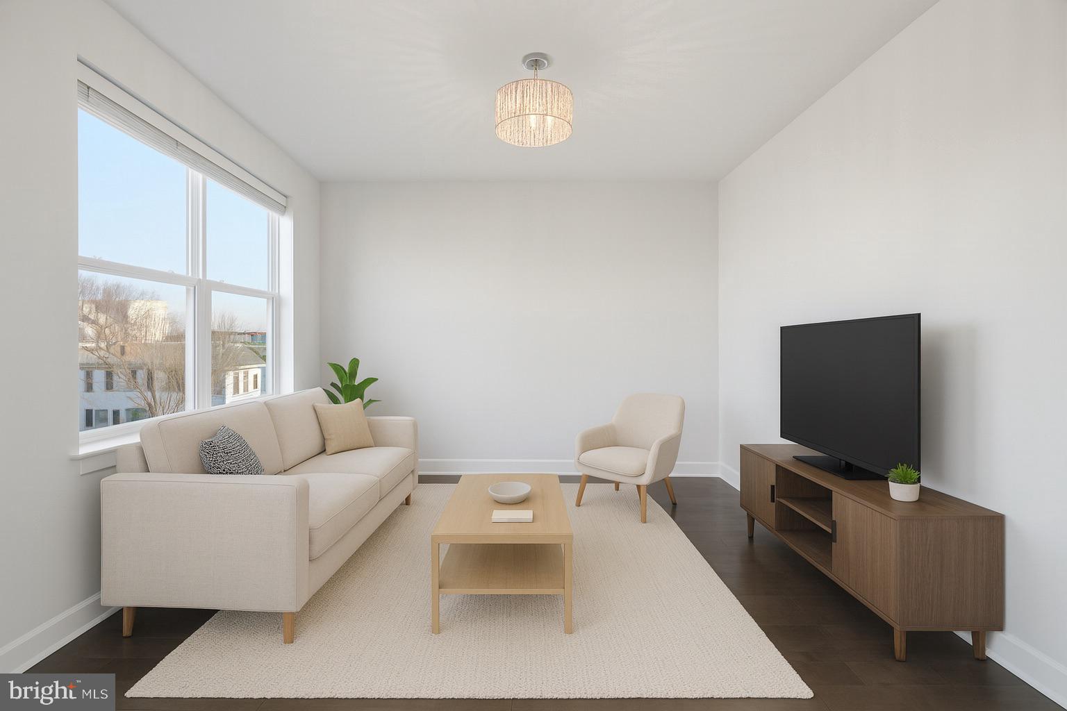 401 15th Street Southeast, Unit 401 Washington, DC 20003 - Photo 7 of 21 a living room with furniture and a flat screen tv