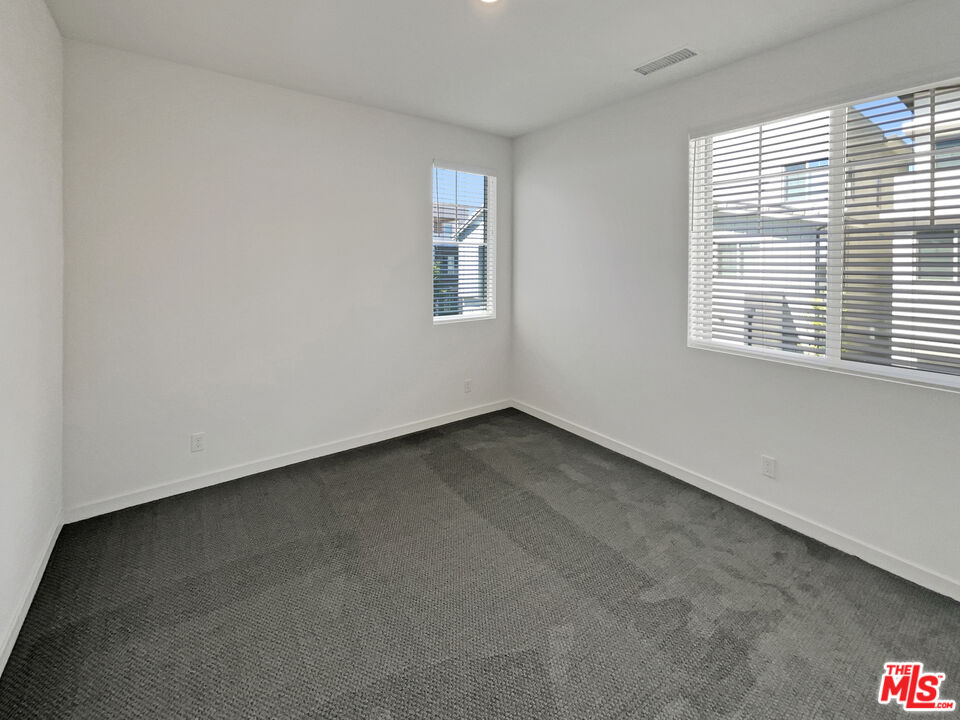 145 Stage Irvine, CA 92618 - Photo 16 of 20 an empty room with a window