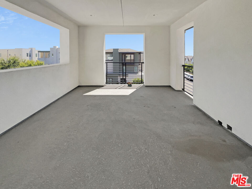 145 Stage Irvine, CA 92618 - Photo 19 of 20 an empty room with a fireplace and cabinet