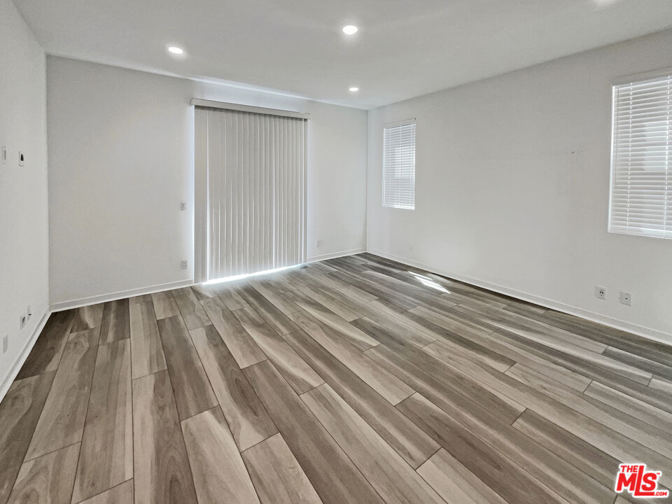145 Stage Irvine, CA 92618 - Photo 5 of 20 a view of empty room with wooden floor