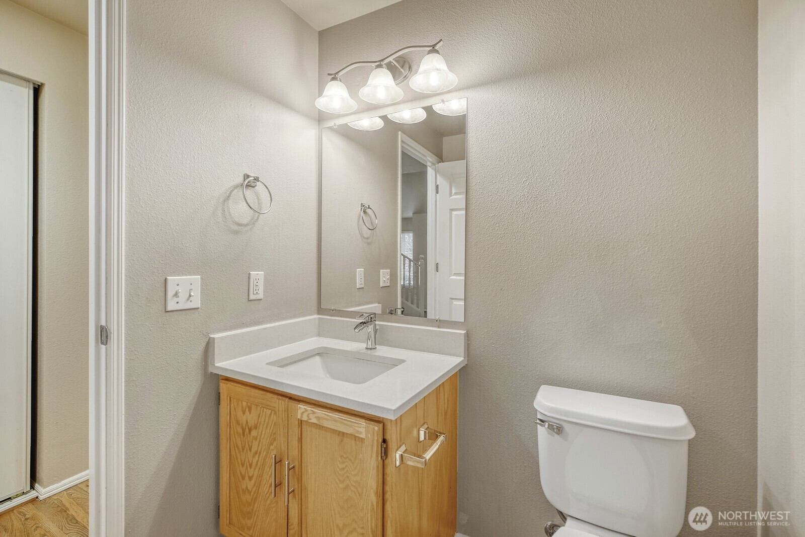 6740 Northeast 1st Place Renton, WA 98059 - Photo 5 of 21 a bathroom with a toilet sink and mirror