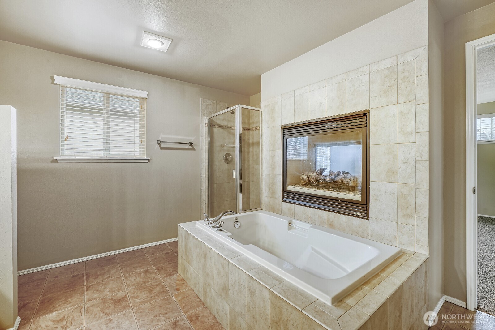 6740 Northeast 1st Place Renton, WA 98059 - Photo 7 of 21 a white bath tub sitting next to a shower