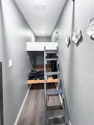 a room with a window and gym equipment