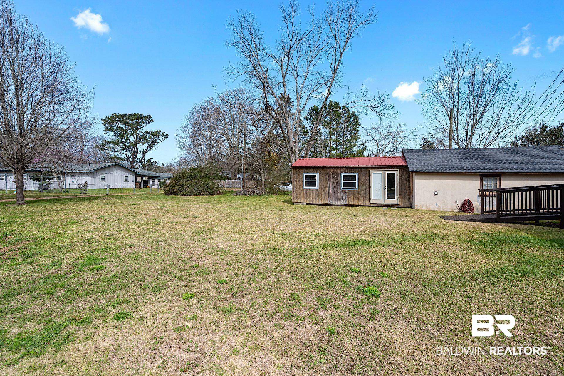 22051 Broad Street Silverhill, AL 36576 - Photo 18 of 28 View of yard with an outbuilding