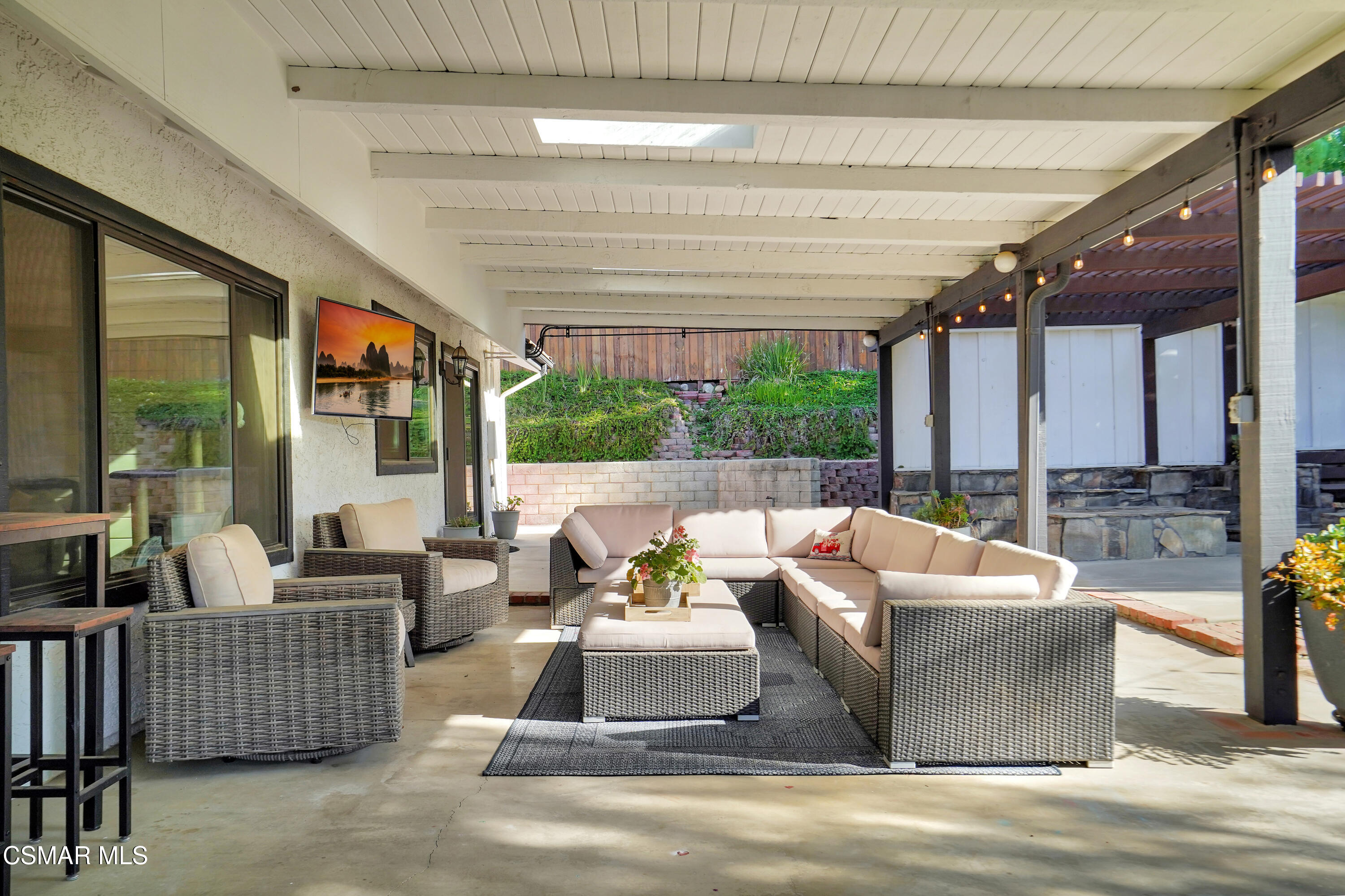 160 Wrangler Road Simi Valley, CA 93065 - Photo 34 of 65 a outdoor space with patio the couches and a dining table with garden view