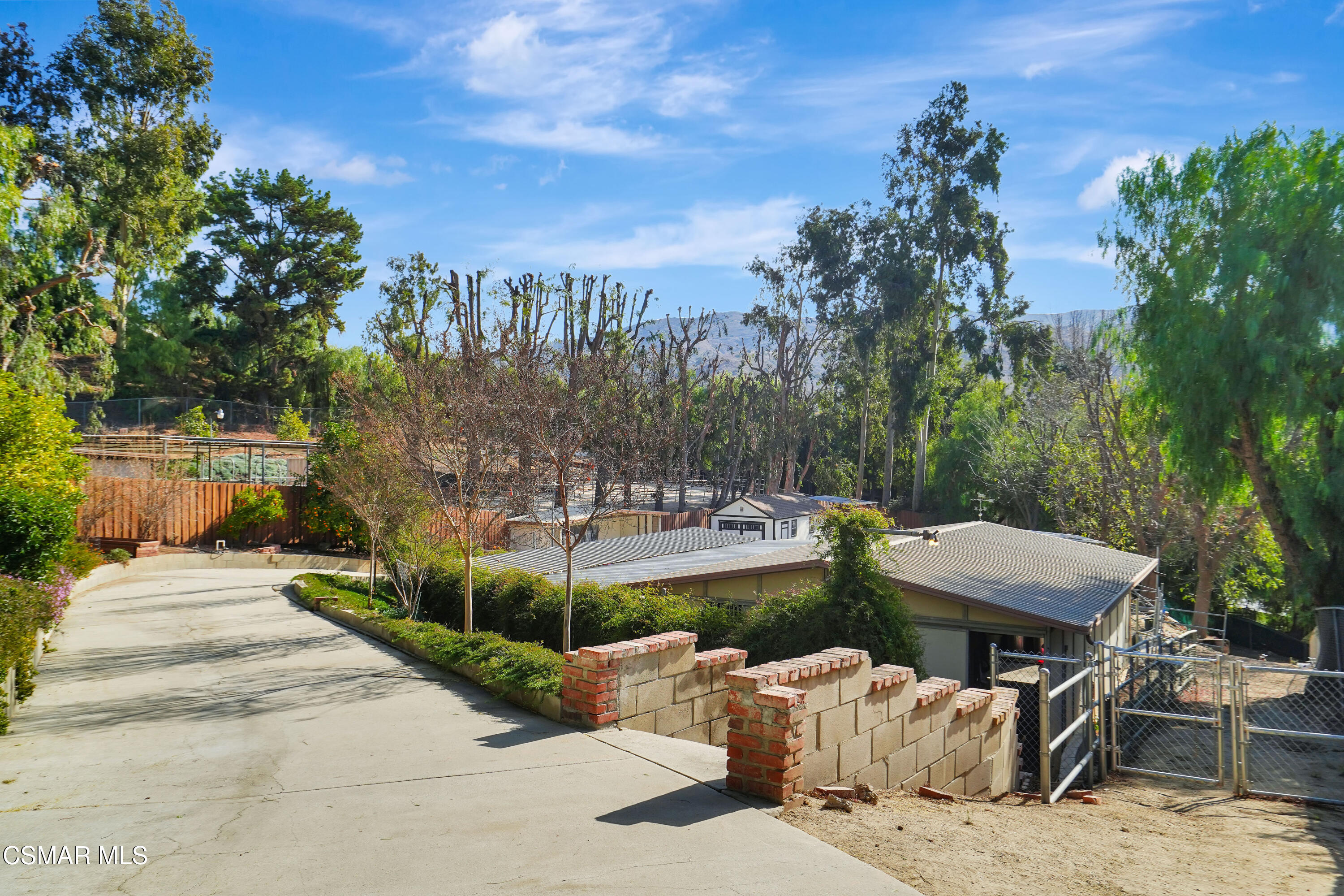 160 Wrangler Road Simi Valley, CA 93065 - Photo 46 of 65 a view of a patio with table and chairs and potted plants