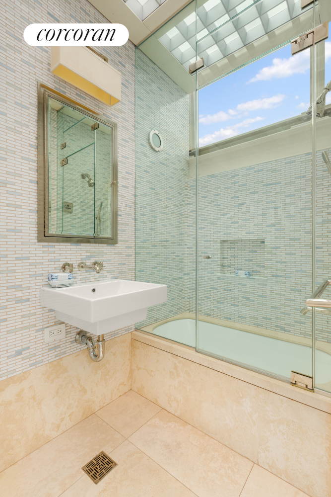 22 Gramercy Park South, Unit PH Manhattan, NY 10003 - Photo 15 of 25 a bathroom with a sink a toilet and shower