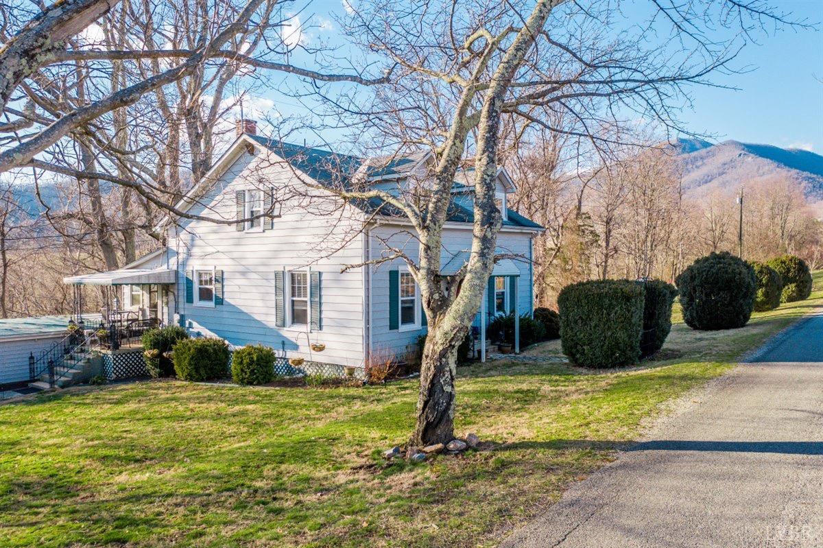 1045 Thrashers Creek Road Amherst, VA 24521 - Photo 1 of 54 a view of a house with a yard