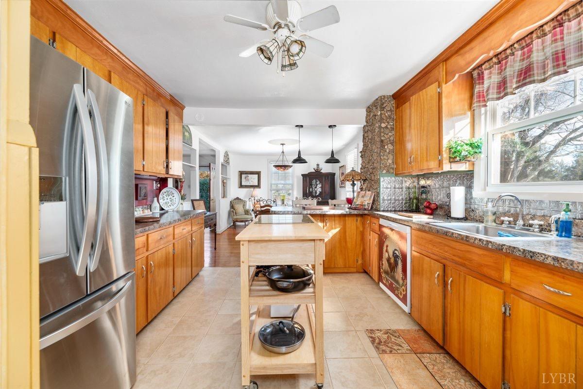 1045 Thrashers Creek Road Amherst, VA 24521 - Photo 12 of 54 a large white kitchen with a large window