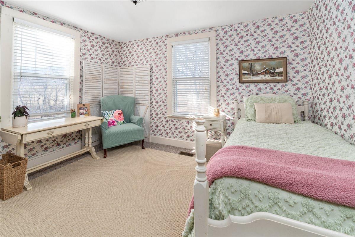 1045 Thrashers Creek Road Amherst, VA 24521 - Photo 16 of 54 a bedroom with a bed and a window