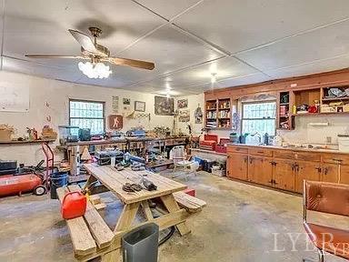 1045 Thrashers Creek Road Amherst, VA 24521 - Photo 28 of 54 a living room with lots of furniture and kitchen view
